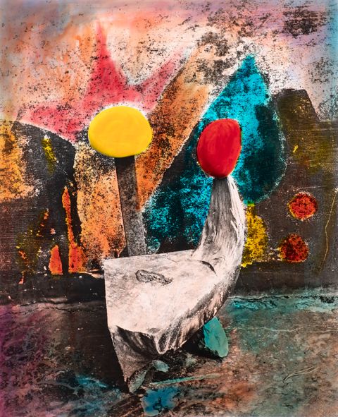 Hand-coloured black and white photograph. Saturated yellow, blue, orange, and yellow fields in this photograph create an abstracted composition. The surface is mottled, as if seen through a tarnished mirror.